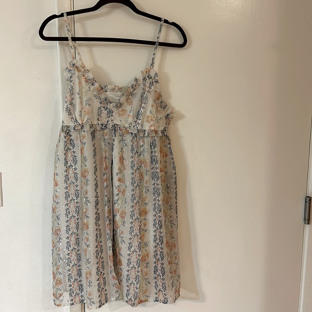 Women’s baby doll dress. Cream and floral print.ruffled detail around bust. XL